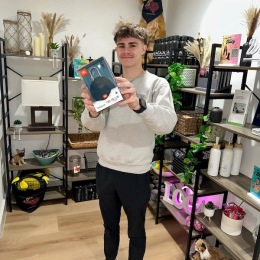 a guy holding a speaker