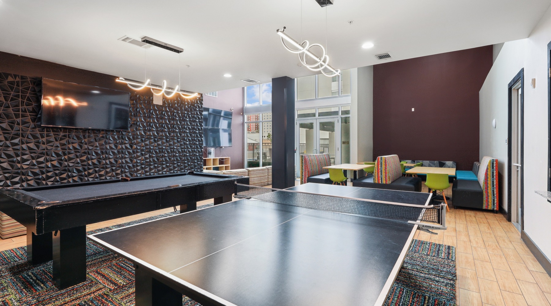 a clubroom with a pool table